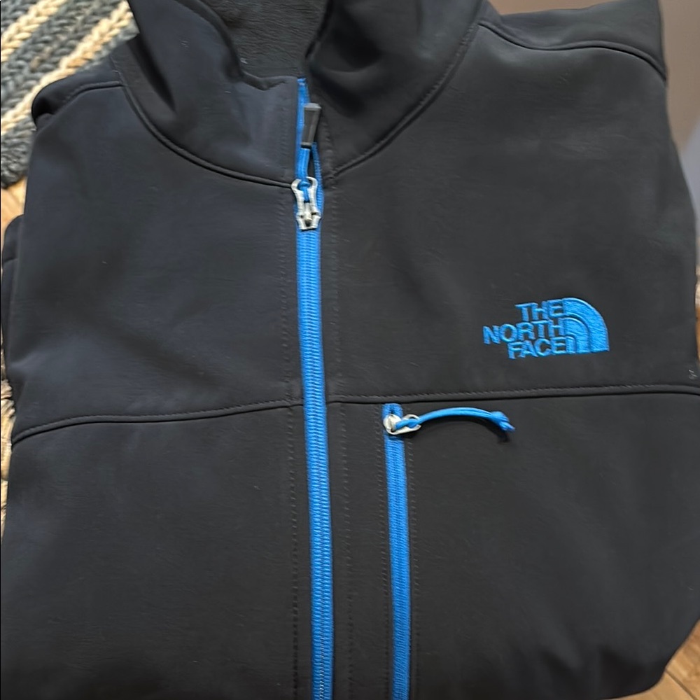 The North Face Black Jacket with Blue Zippers